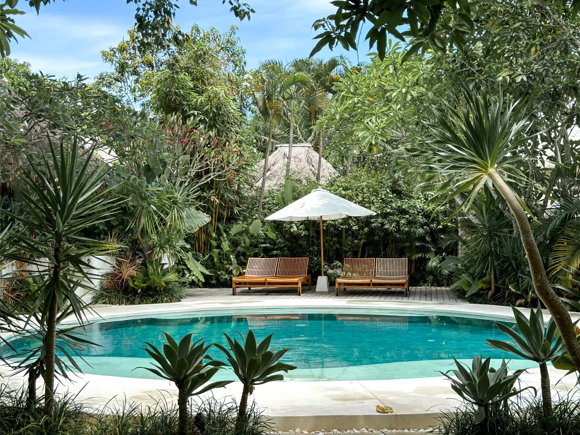 Bodhi Bingin pool surrounded by tropical gardens